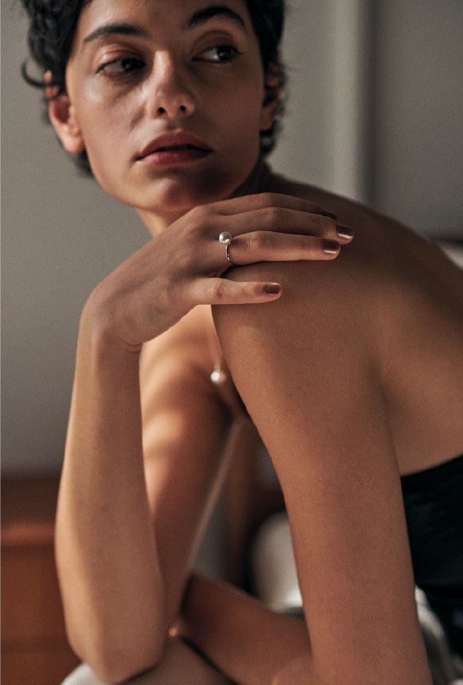 Portrait with a pearl ring in warm light