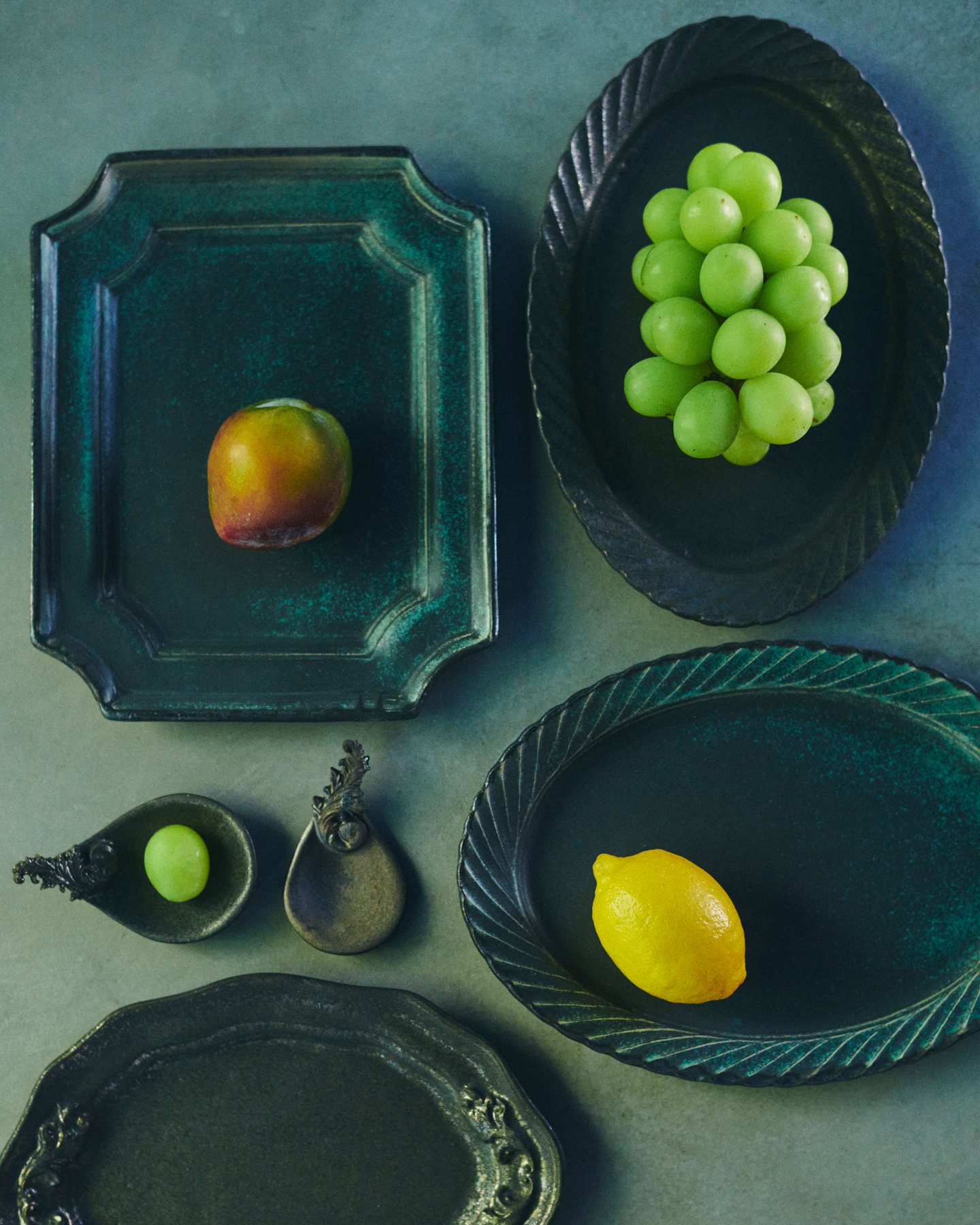 Green ceramic plates with fruit