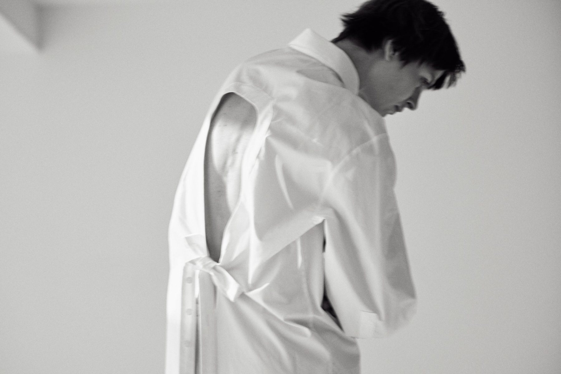 Portrait in a white open-back shirt